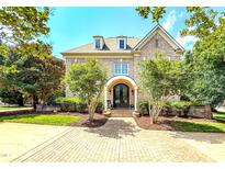 Charming brick home with well-manicured landscaping and a welcoming entrance, perfect for Gathering living and curb appeal at 6005 Carlyle Dr, Raleigh, NC 27614