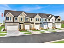 Charming townhome exteriors featuring multiple units and a community atmosphere in a residential neighborhood at 1227 Bessie Ct, Wake Forest, NC 27587