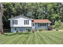 Charming split-level home featuring a well-manicured front lawn, mature trees and pleasant curb appeal at 3509 Crofton Ct, Raleigh, NC 27604