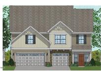 Charming two-story home with a symmetrical facade, stone accents, and attached two-car garage at 60 Black Walnut Dr # 198, Garner, NC 27529