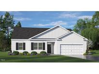 Charming one-story home featuring a two-car garage, manicured lawn, and classic curb appeal with decorative bushes at 1220 Pavo Path, Wendell, NC 27591