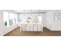 Modern kitchen with white cabinets, marble countertops, and stainless steel appliances at 130 Two Hills Dr # 205B, Carrboro, NC 27510