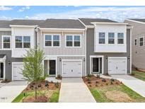 Charming townhomes featuring a modern color scheme and single car garages at 135 Central Townes Way # 305, Raleigh, NC 27603
