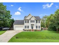 Charming two-story home with blue shutters, an attached garage, and well-manicured lawn with an American flag at 3713 Highland Creek Dr, Apex, NC 27539