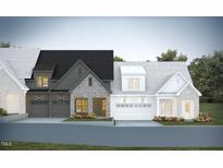 Charming townhomes featuring brick and siding exteriors with attached garages and beautifully landscaped front yards at 1025 Coldspring Circle, Durham, NC 27705