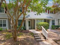 Charming townhome entrance with inviting walkway and well-maintained landscaping, perfect for curb appeal at 105 Sir Richard Ln, Chapel Hill, NC 27517