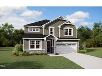 Charming two-story home with stone accents, a well-manicured lawn, and a two car garage at 164 Sprenger St, Garner, NC 27529