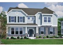 Charming two-story home featuring a stone facade, light blue siding, dark shutters, and a well-manicured front lawn at 60 Guardian St, Youngsville, NC 27596