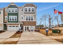 Attractive townhome with modern design, two-car garage, and professional landscaping at 1194 Alston Landing Way # 04, Cary, NC 27519