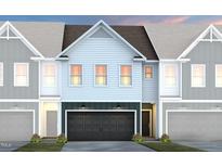 Charming townhome showcasing a contemporary design and inviting two-car garage at 1219 Everton Ave, Durham, NC 27703