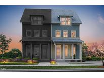 Charming two-story home featuring a covered porch and a combination of painted and unfinished wood siding at 2940 C Chapel Hill Road, Durham, NC 27707