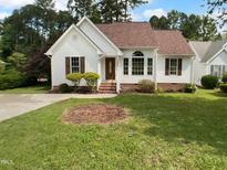 Charming single Gathering home with inviting entrance and well maintained lawn and shrubbery at 3509 Neptune Dr, Raleigh, NC 27604