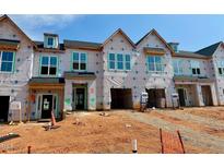 New construction townhomes feature modern design, large windows, and attached garages, ready to be customized at 95 Ripple Way # 212, Clayton, NC 27520