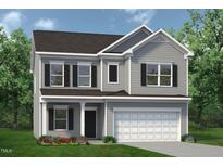 Charming two-story home with gray siding, black shutters, a two-car garage, and a well-manicured lawn at 126 Mildred Place, Broadway, NC 27505