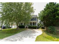 Charming two-story home with inviting front porch and well-maintained landscaping at 328 Mccarthy Dr, Clayton, NC 27527