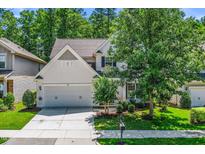 Charming two-story home with a well-maintained lawn and a two car garage at 3661 Manifest Pl, Cary, NC 27519
