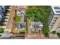 An aerial view of two quaint homes nestled closely together, showcasing their unique architectural details and proximity to each other at 407 N Boylan Ave, Raleigh, NC 27603