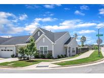 Charming single-Gathering home with well-manicured lawn, stone accents, and inviting curb appeal on a corner lot at 1021 Shellbank Dr, Durham, NC 27703