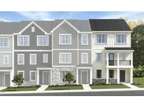 Charming townhome exteriors showcasing a variety of attractive facades, landscaping, and inviting entryways at 1416 Jay Rd, Knightdale, NC 27545