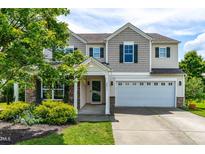 Charming two-story home with a two-car garage, stone accents, and inviting curb appeal at 2011 Unbridled Dr, Knightdale, NC 27545