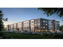 Exterior of a modern apartment building with stone accents and well-maintained landscaping at 2201 W Cornwallis Rd, Durham, NC 27705