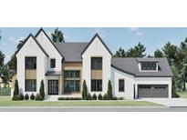Charming home with white brick, dark framed windows, gray roof, and lovely lawn at 249 Mollie Meadow Dr, Zebulon, NC 27597