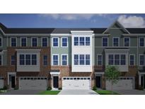 Charming new townhome with brick and siding, featuring a one-car garage and inviting curb appeal at 944 Westerland Way # 140, Durham, NC 27703