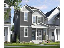 Charming two-story home with gray siding, white trim, a welcoming front porch, and landscaped yard at 111 Weavers Grv Dr, Chapel Hill, NC 27514