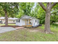 Charming one-story home with a cozy front porch and mature trees at 121 Lena Ct, Burlington, NC 27217