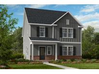 Charming two-story home with gray siding, black shutters, and a cozy front porch at 1216 Hardin Hill Ln, Knightdale, NC 27545