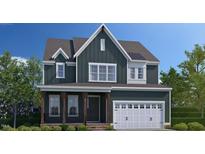 Charming two-story home featuring a two-car garage and traditional architectural details in a desirable community at 2220 Yumeewarra Dr, Apex, NC 27502