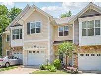 Charming townhome with well-manicured lawn and single-car garage perfect for a starter home at 903 Grace Point Rd, Morrisville, NC 27560
