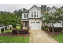Charming two-story home with a one car garage, landscaped front yard, and inviting curb appeal at 241 White Oak Ridge Dr, Garner, NC 27529