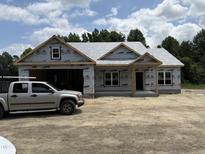 This house is under construction but showcases its exterior elevation and future charm at 4024 N Nc 581 Hwy, Kenly, NC 27542