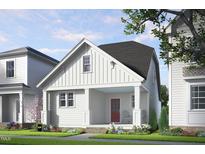 Charming craftsman-style home with white board and batten siding, inviting porch, and red front door at 528 Folk Song Way, Wendell, NC 27591
