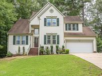 Charming two-story home with manicured lawn and attached two-car garage at 5536 Centipede Trl, Raleigh, NC 27610
