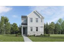 Charming two-story home featuring vertical siding, stone accents, and a welcoming front porch at 5649 Cayden Cove Dr, Wendell, NC 27591