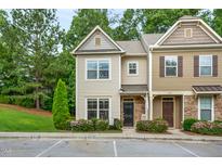 Charming townhouse with a well-maintained lawn and inviting curb appeal on a sunny day at 6301 Pesta Ct, Raleigh, NC 27612