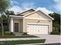 Charming single-Gathering home with a two-car garage and manicured lawn, perfect for suburban living at 1213 Solace Way, Rolesville, NC 27571