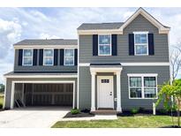 Two-story home with gray siding, black shutters, and an attached two-car garage at 306 Rosewood Dr, Sanford, NC 27330