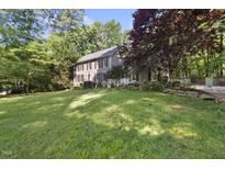 Traditional two-story home with mature trees and expansive lawn in a peaceful setting at 3412 Paddock Cir, Raleigh, NC 27613