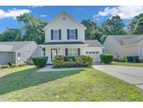 Charming two-story home with black shutters and a well-manicured lawn at 5617 Tealbrook Dr, Raleigh, NC 27610