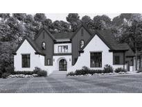 Stunning new construction featuring a stylish mix of painted brick and vertical board and batten at 115 Evington Dr # 29, Pittsboro, NC 27312