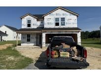 New construction featuring craftsman style details and welcoming front entry ready for your design at 29 Chloe Ct, Selma, NC 27576