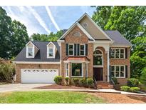 Charming two-story brick home with a two car garage and manicured front yard at 3 White Ash Dr, Durham, NC 27712