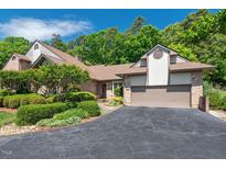 Stunning brick home with a two-car garage and lush landscaping at 104 Cedar Ridge Way, Durham, NC 27705