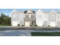 New townhome exterior showing the stone and siding details on the front facade at 1131 Weavers Trace Dr, Zebulon, NC 27597