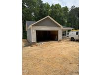 New construction shows a one-story home with an attached two car garage and neutral siding and trim at 185 Rollins Acres Ln, Lillington, NC 27546