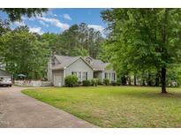 Charming single-story home with a well-manicured lawn and beautiful landscaping at 313 Teresa Dr, Rolesville, NC 27571