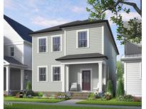 Charming two-story home with a covered porch and beautifully landscaped front yard at 524 Folk Song Way, Wendell, NC 27591